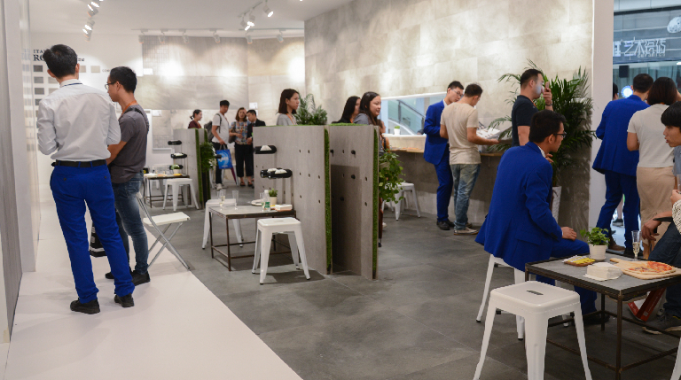 Exhibition Stall Designer in Gurgaon team reviewing material for Exhibition Stall Fabrication Services