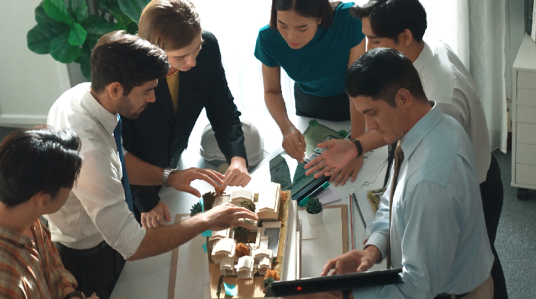 Employees participating in creative csr activities managed by event organiser companies