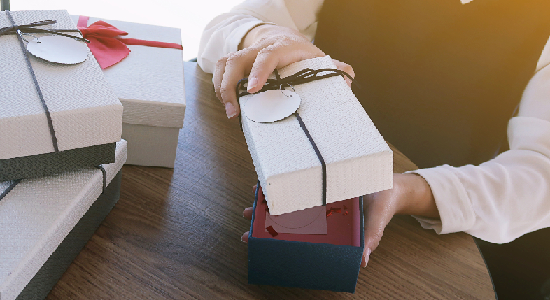 A premium bespoke corporate gift box being unboxed in a luxury Delhi NCR setting